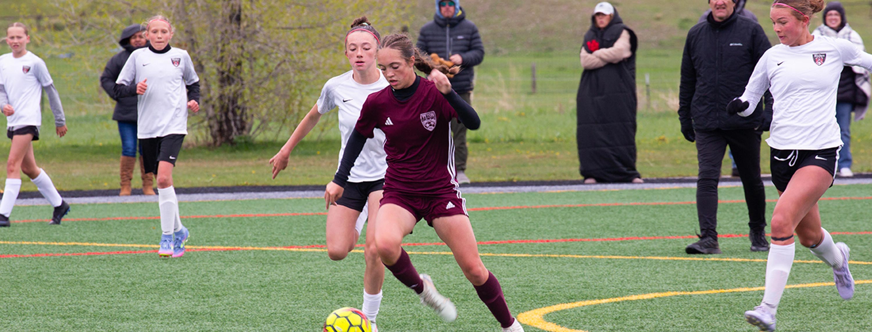 Girls playing soccer with Teton FC